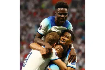 MUDA MENYERLAH: Saka (paling atas) dan Bellingham (paling kanan) meraikan gol Raheem Sterling (tengah) bersama Harry Kane dalam kemenangan 6-2 England ke atas Iran kelmarin. - Foto-foto REUTERS 