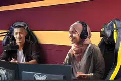 SAJIAN DUA ‘A’: Penyampai radio kecerdasan buatan atau AI, Aina (kanan) dan rakannya Aiman mencipta sejarah dengan lagu Trust The Code. 
