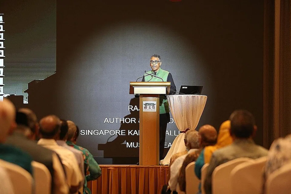 CONTOH HARMONI: Encik Raja Mohamad (atas) dan Encik A.R. Mashuthoo, penulis buku 'Singapore Tamil Muslims', memaparkan satu contoh ruang bersama fizikal dalam buku mereka - Masjid Moulana Mohamad Ali - yang dibina pada 1950-an di sekitar Raffles Place dan Market Street dan kemudian berpindah ke besmen bangunan UOB setelah bank itu memperoleh tanah di tapak masjid tersebut.