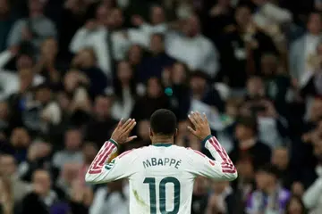 Penyerang Real Madrid, Kylian Mbappé, meraikan jaringan gol kedua pasukannya ketika menentang Sevilla dalam perlawanan LaLiga di Stadium Santiago Bernabéu, Madrid, Sepanyol, pada 18 Oktober 2026.
