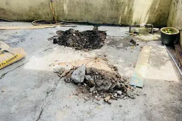 Lokasi mayat bayi ditemukan ditanam di bawah lantai simen di bahagian anjung kereta sebuah rumah di Taman Sri Rokam, Ipoh, Perak, pada 28 Ogos. 