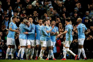 RAIKAN GOL: Pemain Manchester City, Phil Foden (empat dari kanan) meraikan gol bersama rakan-rakan selepas menjarikan gol keenam sewaktu peringkat suku akhir Liga Juara-Juara Eropah. City membelasah wakil Jerman, Schalke 7-0. - Foto EPA-EFE