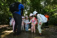 Beberapa murid Tadika 1 (K1) daripada prasekolah My First Skool melangkah masuk ke dalam lopak lumpur buat kali pertama semasa satu sesi pembelajaran luar bilik darjah di Taman Alam Semula Jadi Chestnut pada 14 Oktober.