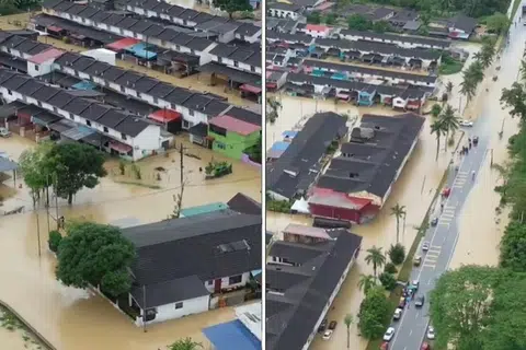 NAIK AIR: Deretan rumah di Taman Aman, Kota Kecil, Kota Tinggi, kelihatan separuh ditenggelami air banjir.