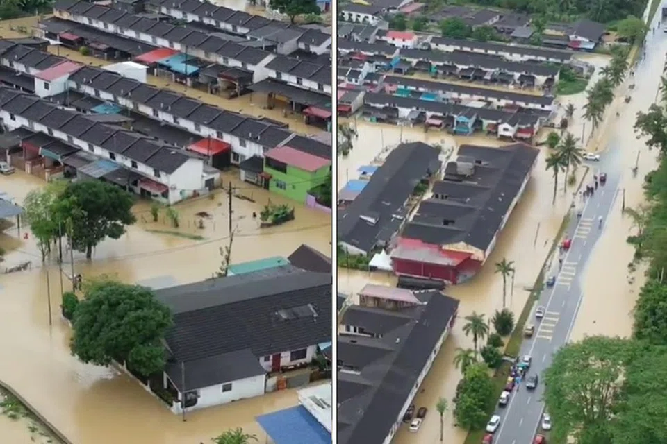 NAIK AIR: Deretan rumah di Taman Aman, Kota Kecil, Kota Tinggi, kelihatan separuh ditenggelami air banjir.
