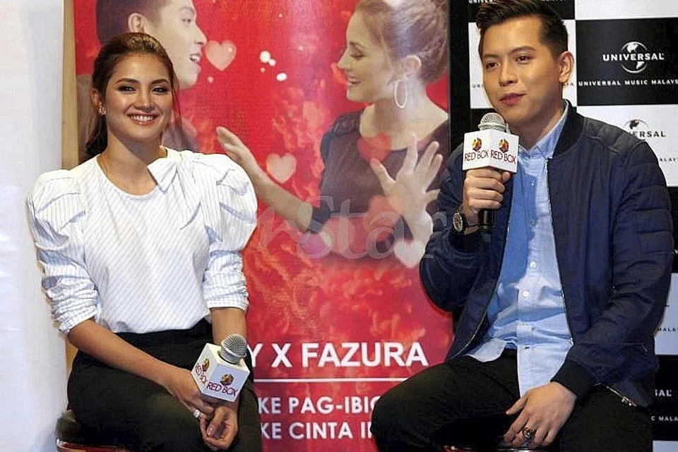 MAHU CAPAI IMPIAN: Fazura tidak pedulikan kritikan dan terus mengejar impiannya menjadi penyanyi. Beliau bekerjasama dengan penyanyi Filipina, Jason Dy (di kiri Fazura) dalam lagu duet Nothing Like Pag-ibig yang dilancarkan baru-baru ini. - Foto MSTAR ONLINE