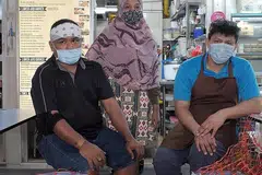 SEDIA BERTAHAN: Setelah tutup gerai makan di Institut Teknologi Singapura (SIT) disebabkan perniagaan yang lembap dek Covid-19, Encik Mohd Adillah Kamsan (kiri) dan rakan-rakan niaganya kini memberi tumpuan kepada gerai Tasty'J Western and Mediterranean Cuisine mereka di Pusat Makanan Amoy Street pula, yang baru saja dibuka pada hujung Mac lalu. - Foto BM oleh GAVIN FOO