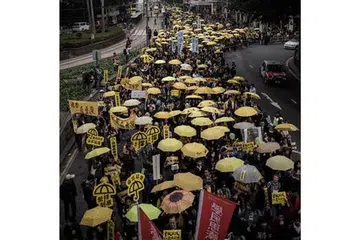 TUNTUT DEMOKRASI: Kira-kira 3,000 penunjuk perasan prodemokrasi kembali buat pertama kali berbaris di jalan raya Hongkong sejak tunjuk perasaan besar-besaran telah melumpuhkan hab kewangan global lewat tahun lalu. - Foto AFP