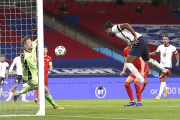 GOL PERTAMA: Penyerang England Calvert-Lewin, menanduk masuk bola untuk menjaringkan gol pertamanya dalam penampilan sulungnya bersama pasukan England. - Foto REUTERS