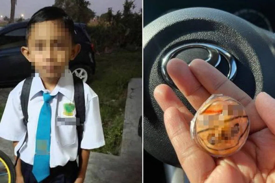 Mohamad Fahmi Hafiz Mohamad didapati rebah luar sekolah setelah memakan gula-gula kenyal berbentuk bola mata. 