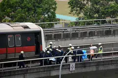 SIASATAN SELESAI: Menurut SMRT, kematian Allahyarham Nasrulhudin Najumudin, 26 tahun, dan Allahyarham Muhammad Asyraf Ahmad Buhari, 24 tahun, boleh dielakkan sekiranya langkah-langkah keselamatan dilaksanakan. - Foto THE STRAITS TIMES