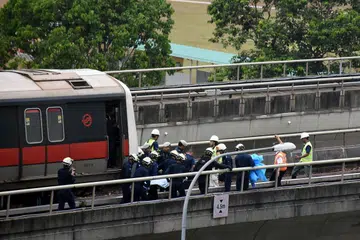 SIASATAN SELESAI: Menurut SMRT, kematian Allahyarham Nasrulhudin Najumudin, 26 tahun, dan Allahyarham Muhammad Asyraf Ahmad Buhari, 24 tahun, boleh dielakkan sekiranya langkah-langkah keselamatan dilaksanakan. - Foto THE STRAITS TIMES