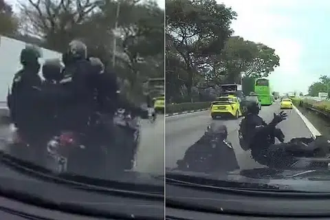 NAHAS DI TENGAH JALAN: Dua motosikal yang ditunggang anggota Pasukan Kerahan Pantas saling menggesel satu sama lain sebelum terjatuh di Ekspreswe Rentas Pulau. - Foto FACEBOOK/SHAIFUL APEK