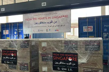 Dua kontena sebesar 40 kaki mengandungi bekalan bantuan kemanusiaan di Gudang Pacific International Lines di Singapura pada Disember 2024.