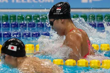TERLEPAS PINGAT: Perenang negara, Letitia Sim nyaris memenangi pingat dalam acara 100 meter kuak dada wanita pada Rabu. Beliau mengakhiri perlumbaan 0.12 saat di belakang pemenang pingat gangsa. 