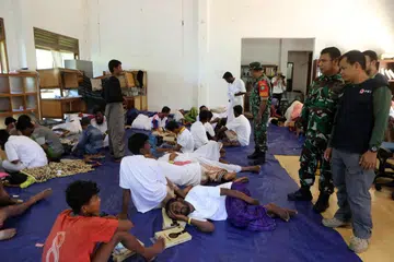 Pelarian Rohingya berehat di pusat perlindungan sementara di Pejabat Palang Merah Indonesia, selepas dipindahkan dari laut di Meulaboh, Aceh Barat, Indonesia, pada  22 Mac 2024. Pelarian Rohingya ditempatkan di pusat perlindungan selepas penyelamat Indonesia telah menyelamatkan sekurang-kurangnya 69 Rohingya, yang telah ditemui oleh nelayan pada 20 Mac, 
