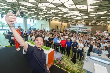 TINGKAT KEPERLUAN MAKANAN: Timbalan Perdana Menteri, Encik Lawrence Wong, ketika menghadiri pelancaran pameran pelan induk Lim Chu Kang di Safra Choa Chu Kang pada Sabtu. 