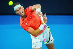 KEMBALI BERSAING: Pemain Sepanyol, Rafael Nadal, membuat pukulan ketika berganding dengan Marc Lopez menentang pemain Australia, Max Purcell dan Jordan Thompson, semasa perlawanan beregu lelaki di Kejohanan Tenis Antarabangsa Brisbane, di Brisbane pada 31 Disember.
