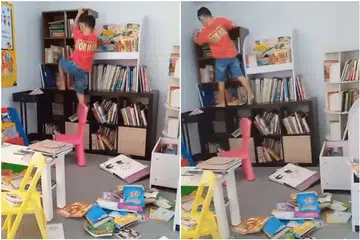TIDAK TERURUS : Rak-rak buku dipanjat dan buku berselerak di lantai kolong blok di Boon Lay itu.