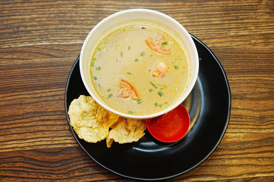 ‘Soto Betawi’ ($12.50) pekat dan kaya rasa, mengandungi daging, kentang serta tomato. Nasi bakar juga boleh dipesan pada harga $3.