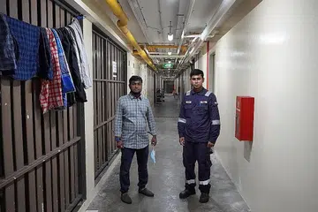 LEGA KEADAAN SEMAKIN PULIH: Walaupun masih terdapat beberapa sekatan ketat dilaksanakan di dormitori Westlite Toh Guan, pekerja dari Bangladesh, Encik Mohiuddin (kiri) dan Encik Islam tetap bersikap positif terhadap usaha untuk mengekang penularan Covid-19 di Singapura serta bantuan yang diberikan untuk menyokong mereka. - Foto BM oleh NUR HUMAIRA SAJAT