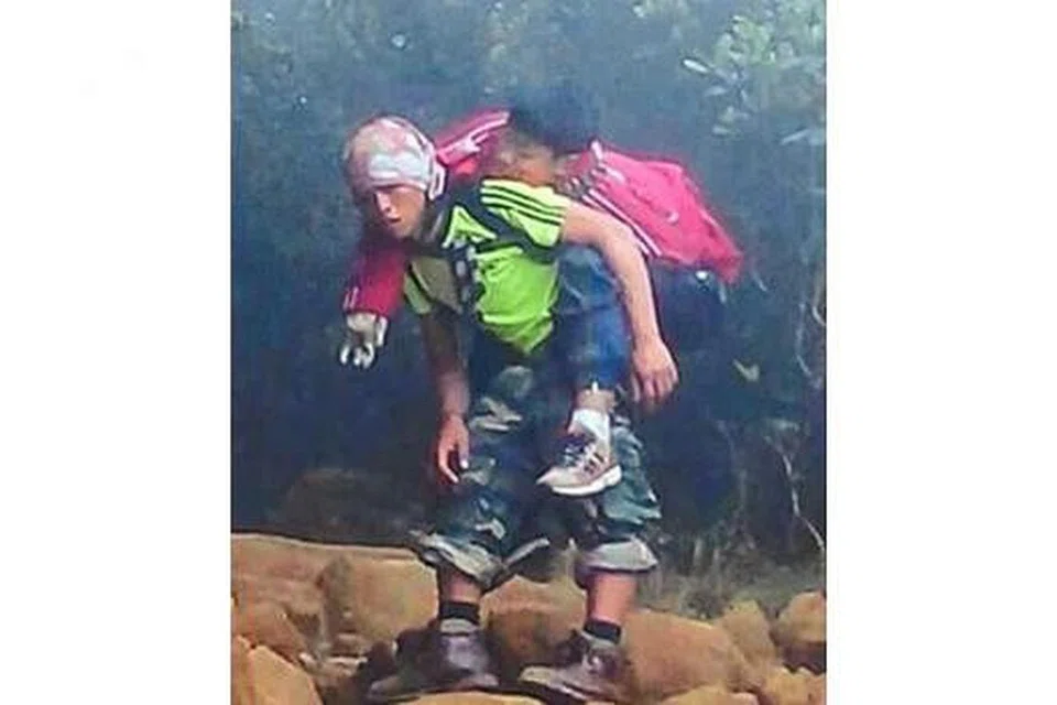 ENCIK RIZUAN KAUHININ: Menganggap tindakannya menggendong seorang pelajar Singapura sejauh beberapa kilometer demi menyelamatkan nyawa budak itu sebagai satu tanggungjawab dan bukan tindakan hero. - Foto FACEBOOK