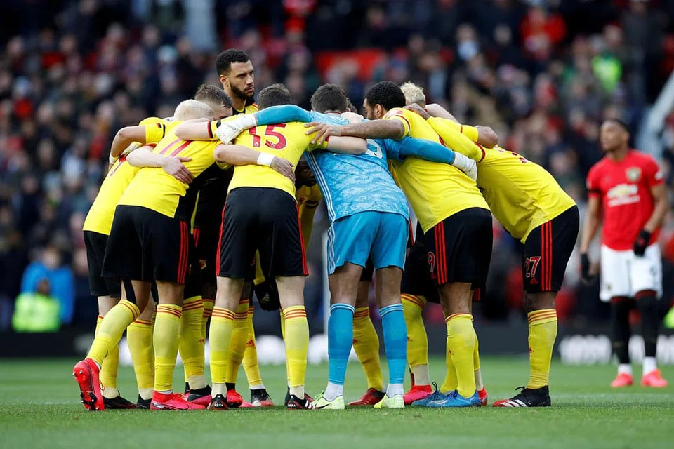 Pemain Watfoardn sebelum satu perlawanan Februari lali.- Foto fail REUTERS