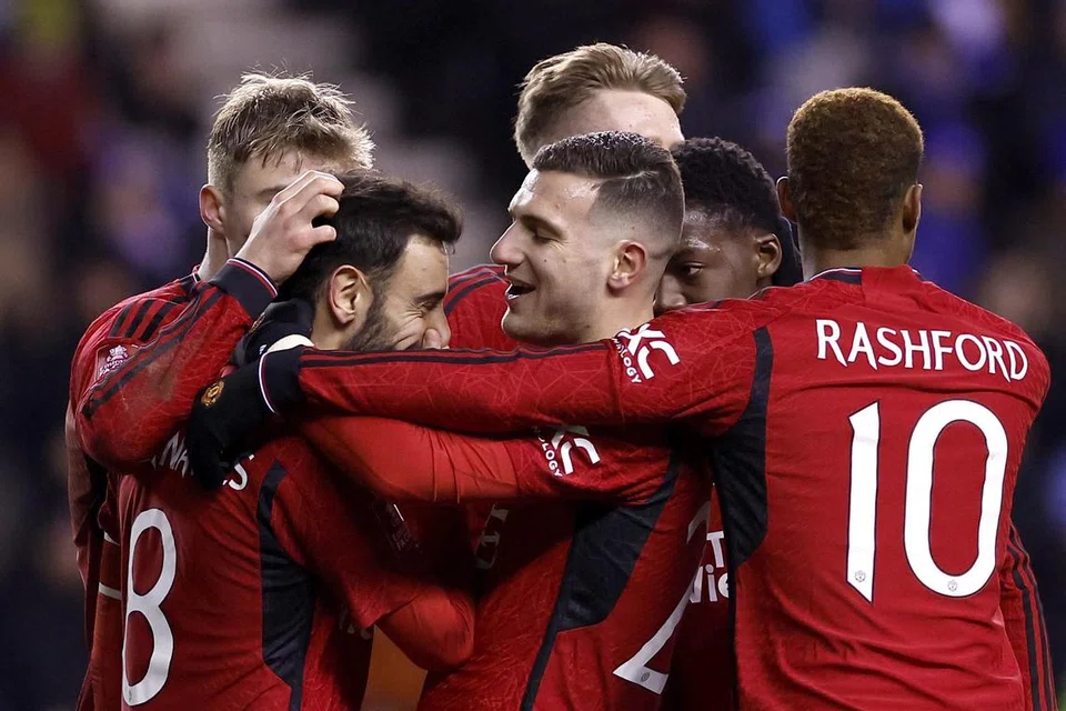 TIADA MASALAH: Meskipun tanpa beberapa pemain tunggak, United masih mampu atasi cabaran Wigan Athletic baru-baru ini.