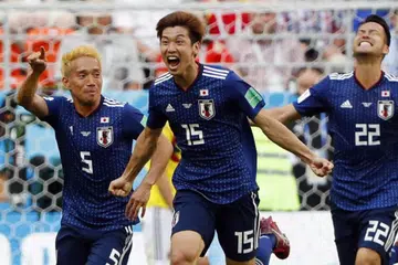 SAMBUT KEMENANGAN: Yuya Osako (tengah) menyambut kemenangan Jepun bersama rakan sepasukannya Yuto Nagatomo (kiri) dan Maya Yoshida selepas menewaskan Colombia.