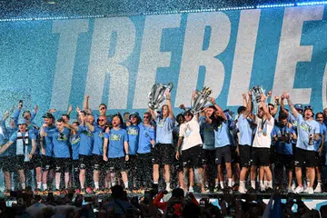 PALING BERJAYA: Pemain Manchester City meraikan kemenangan tiga piala utama bersama penyokongnya di kota Manchester baru-baru ini. Kejayaan Manchester City untuk memenangi Liga Juara-Juara Eropah musim ini turut mencerminkan kekuatan Liga Perdana England di Eropah. Pendapatan liga itu jauh lebih tinggi berbanding liga-liga lain di benua itu. 