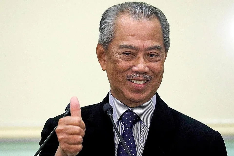 DISENANGI RAKYAT: Tujuh daripada 10 rakyat Malaysia berpuas hati terhadap prestasi Tan Sri Muhyiddin sebagai perdana menteri. - Foto REUTERS