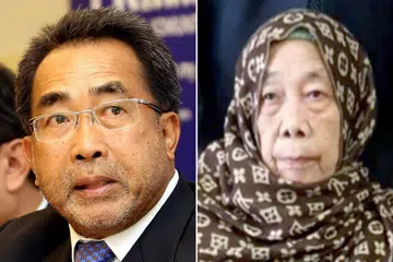 ALLAHYARHAM TAN SRI DR JAMALUDDIN JARJIS (kiri). CIK AMINAH ABDULLAH (kanan)