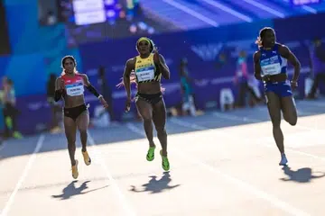 Shanti Pereira (kiri) menamatkan perlumbaan di tempat ketiga di belakang Ashanti Moore dari Jamaica (tengah) dan pemenang, Adaejah Hodge dari Kepulauan Virgin British (kanan), dalam separuh akhir kedua acara 200 meter wanita Sukan Komanwel Glasgow pada 30 Julai.