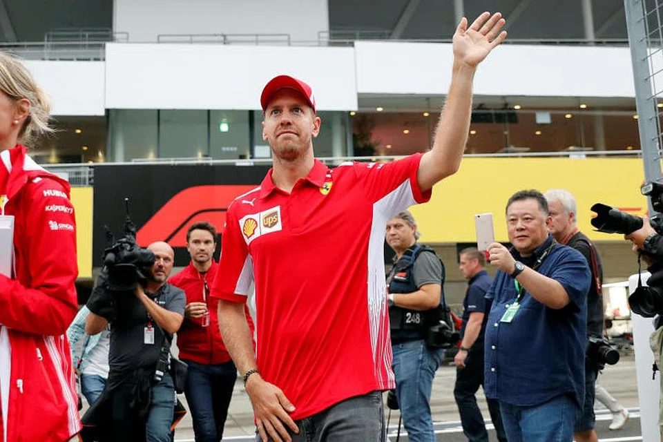GRAND PRIX JEPUN: Pemandu Ferrari Sebastian Vettel bertemu dengan peminatnya sebelum perlumbaan Formula 1 (F1) Grand Prix Jepun di Suzuka, Jepun, pada 4 Oktober 2018.