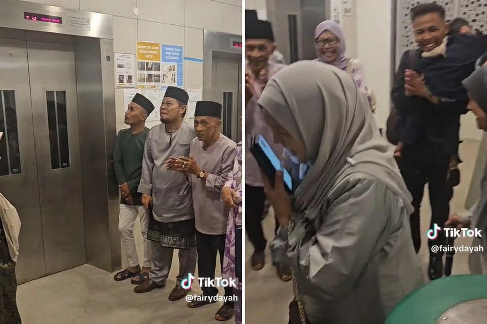 Keluarga memberi tepukan tanda galakan apabila seorang saudara mereka yang tertinggal di tingkat atas akhirnya tiba di lantai pertama.
