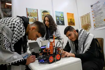 Peserta Palestin - (dari kiri) Jehad Abudayyeh, Razan Shawar dan Mustafa Assi - bertanding dalam kategori Inovator Akan Datang (Future Innovators).