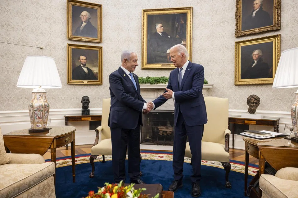 Perdana Menteri Israel Encik Benjamin Netanyahu (kiri) bersalaman dengan Presiden Amerika Syarikat Encik Joe BIden dalam pertemuan di Rumah Putih pada 25 Julai lalu.