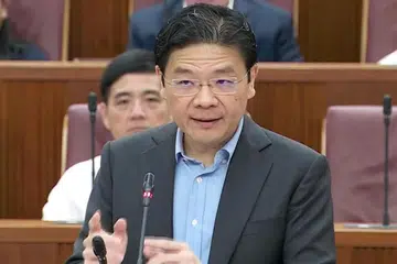 ENCIK WONG: Berbanding dengan rakyat di negara lain, warga Singapura membayar cukai yang lebih rendah. - Foto MCI