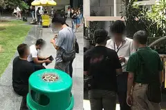 DIPERIKSA: Pegawai Kastam Singapura yang berpakaian preman menjalankan pemeriksaan ke atas perokok di kawasan pusat bandar (CBD) Jumaat lalu. - Foto KASTAM SINGAPURA
