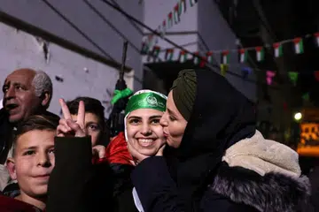 KESYUKURAN MELIMPAH-RUAH: Cik Asil al-Titi disambut mesra anggota keluarganya tidak lama selepas dibebaskan daripada penjara Israel.