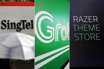 MINAT BUAT PERMOHONAN: Antara syarikat-syarikat yang berminat memohon perbankan digital termasuk Singtel, Grab, Razer dan Validus. - Foto-foto fail