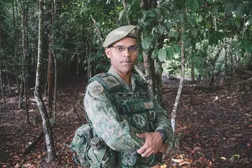 PELBAGAI TANGGUNGJAWAB: SLTC Mohamed Feroz turut terlibat dalam pengurusan keselamatan semasa Rahat Mesyuarat Menteri Pertahanan Asean (ADMM) dan Rumah Terbuka Tentera Darat (AOH) selain memimpin askar bagi mempertahankan Singapura. Beliau antara lebih 500 anggota SAF yang dinaikkan pangkat tahun ini. - Foto MINDEF