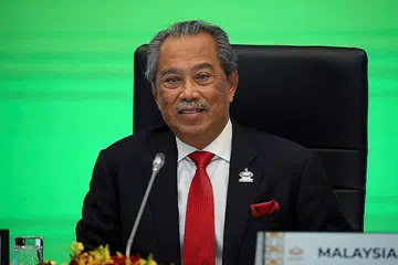 MASA DEPAN JADI TANDA TANYA: Perdana Menteri Malaysia Tan Sri Muhyiddin Yassin ketika berucap di perasmian Mesyuarat Pemimpin Ekonomi Apec pada tahun lalu. - Foto REUTERS