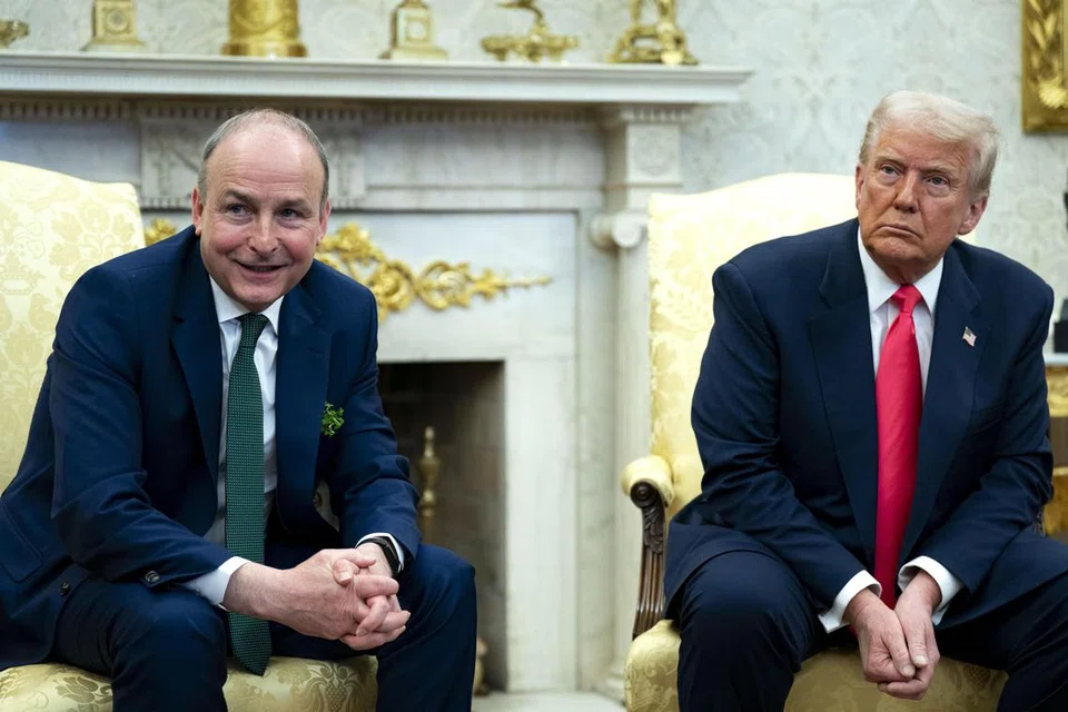 Presiden Amerika Syarikat, Encik Donald Trump (kanan), bersama Perdana Menteri Ireland, Encik Micheal Martin, semasa pertemuan mereka di Pejabat Oval, Rumah Putih, Washington, Amerika Syarikat, pada 12 Mac.