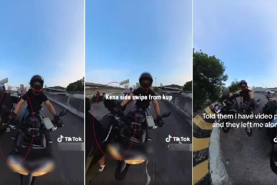 Tangkap layar video menunjukkan seorang penunggang yang dipercayai rakyat Malaysia kelihatan sengaja melanggar kotak barang ke tuil brek tangan penunggang asing.