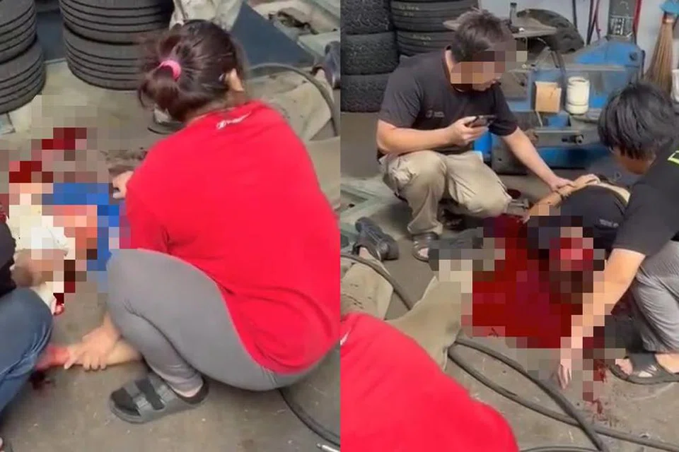 Tangkap layar video tular memaparkan dua lelaki berlumuran darah selepas tayar jenis jentolak meletup secara tiba-tiba dalam kejadian di Bandar Baru Sungai Buloh, Selangor, pada 30 April.