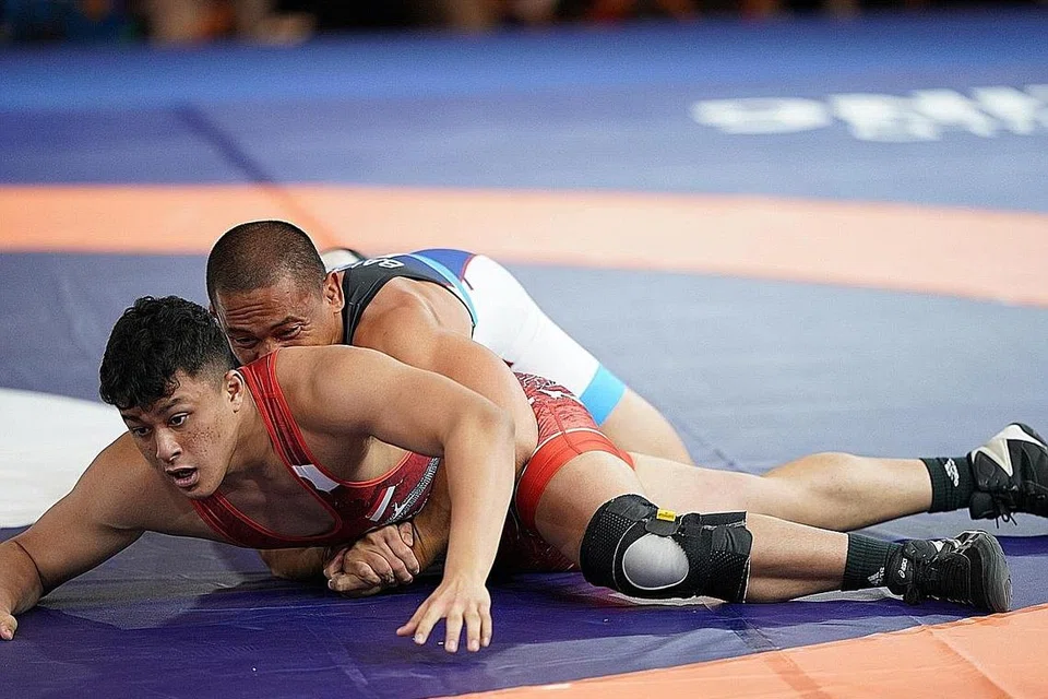 LUAR JANGKAAN: Aryan Azman meraih perak dalam penampilan sulung di Sukan SEA. - Foto MAJLIS OLIMPIK KEBANGSAAN SINGAPURA