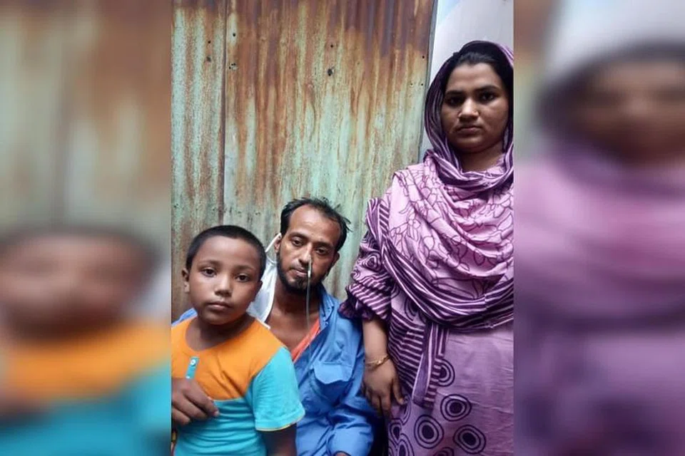 KEMBALI BERSAMA KELUARGA: Encik Sikdar (tengah) berasa amat bersyukur kerana diberi kesempatan untuk bertemu isterinya Moshumi Akhter, 27 tahun dan anak mereka, Mahim. 