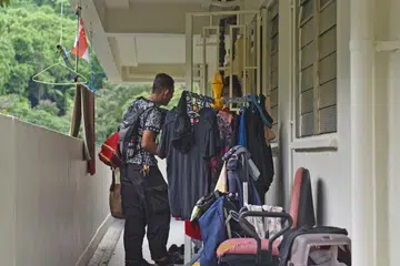 TEMPAT BERTEDUH: Jika dahulu Encik Abdullah sekeluarga tinggal di koridor luar rumah sewa anak perempuannya, mereka kini mempunyai rumah sewa sendiri. - Foto BH oleh JASMINE CHOONG