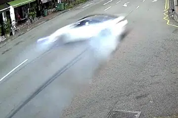 KEMALANGAN MAUT: Encik Long memandu kereta BMW M4 berwarna putih (gambar atas) pada sekitar 5.40 pagi apabila ia merempuh sebuah rumah kedai sebelum terbakar. - Foto-foto fail, PEMBACA ST